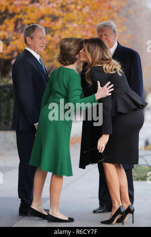 Washington, DC, USA. 04th Dec, 2018. Former first lady Laura Bush and former President George W. Bush greet President Donald Trump and first lady Melania Trump outside of Blair House December 04, 2018 in Washington, DC, USA. The Trumps were paying a condolence visit to the Bush family who are in Washington for former President George H.W. Bushs state funeral and related honors. Credit: Chip Somodevilla/Pool via CNP | usage worldwide Credit: dpa/Alamy Live News Stock Photo