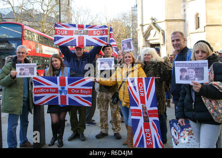 London, UK. 4th Dec, 2018. Supporters of the victims are seen with flags outside the Royal Courts Of Justice, London. Supporters of Josh Kennedy aged 16, Harry Rice aged 17 and George Wilkinson aged 16, who were killed on the 26 January 2018 in Hayes, west London following a car crash are seen outside Royal Courts of Justice, London as the court hears Jaynesh Chudasama's appeal to reduce the sentence passed by Old Bailey early this year. The protesters are calling for stiffer sentences for dangerous drivers. Jaynesh Chudasama 28, of Hayes was more than two and a half times ov Stock Photo