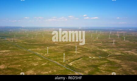 (181205) -- BEIJING, Dec. 5, 2018 (Xinhua) -- Aerial photo taken on Aug. 24, 2018 shows the Taiyangshan wind power station in the city of Wuzhong, northwest China's Ningxia Hui Autonomous Region. China has been delivering on its commitment to the international community on climate change by continuously shifting to a more green economy over the past years. New energy-rich regions like Inner Mongolia and Ningxia are sending more electricity generated from clean energy to the country's bustling east to help reduce the country's heavy reliance on coal in the fight against pollution and co Stock Photo