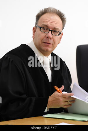 05 December 2018, Saxony, Chemnitz: Public prosecutor Stephan Butzkies is preparing for the murder trial of three defendants in the courtroom of the regional court. The three Germans, aged between 22 and 26, are said to have killed an acquaintance on the night of 18 April 2018. They are said to have been extremely brutal and to have severely maltreated the 27-year-old victim. Photo: Hendrik Schmidt/dpa-Zentralbild/dpa Stock Photo