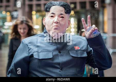London, UK. 5th Dec, 2018. A city trader arrives in fancy dress cosplay as Supreme Leader of North Korea, Kim Jong-un, ready to attend the 26th annual ICAP global charity day. Credit: Guy Corbishley/Alamy Live News Stock Photo