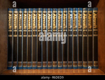 Set of illustrated Encyclopedia of Aircraft on a book shelf in an English house Stock Photo