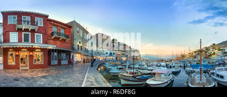 Hydra, Greece - October 4th, 2018: Panoramic view of the waterfront and their commercial center in Hydra, Greece. Stock Photo