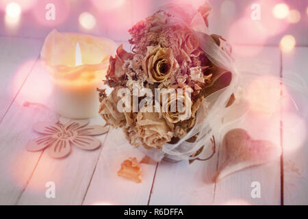 wedding still life with dried bouquet of roses Stock Photo