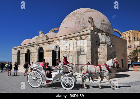 Gyali Tzamisi (Also Known As Kucuk Hasan Pasha Mosque) At The Venetian Harbor Of Chania, Crete, Greece Stock Photo