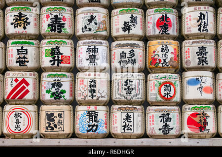 Traditional Sake Barrels Wrapped In Straw At Meiji Shrine In Tokyo, Japan Stock Photo