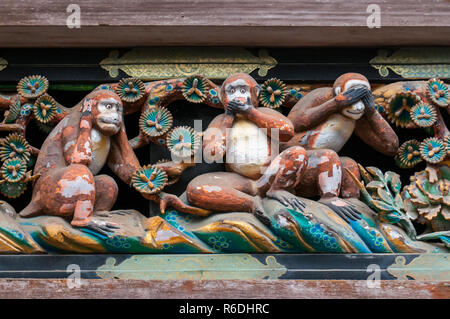 Famous Wood Carvings See No Evil, Speak No Evil And Hear No Evil Of The Three Wise Monkeys At Tosho-Gu Wood Carvings At A Store House In Nikko Tosgogu Stock Photo