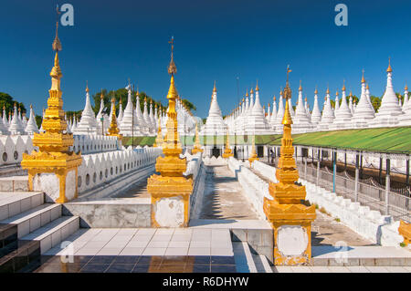 Golden Sandamuni Pagoda With Row Of White Pagodas Amazing Architecture Of Buddhist Temples At Mandalay, Burma Stock Photo