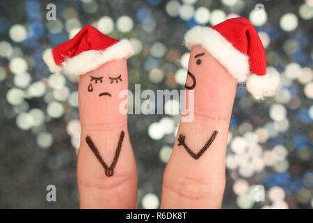 Fingers art of couple celebrates Christmas. Concept of man and woman during quarrel in New Year. Stock Photo