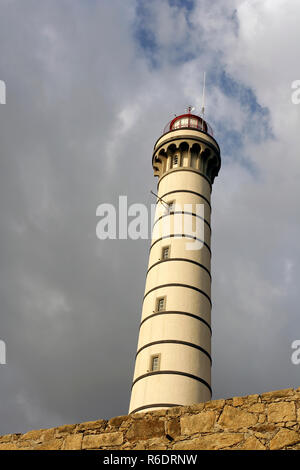 Ancient lighthouse. One of the several lighthouses of the portuguese coast, near Porto; late evening light. Stock Photo