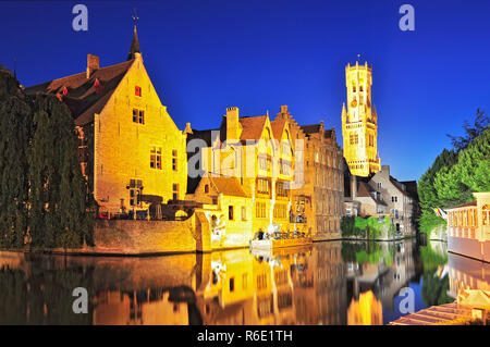 View Of Canal Belfry And Houses At Bruges Belgium Stock Photo