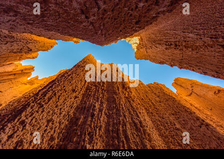 Cathedral Gorge State Park is located in a long, narrow valley in southeastern Nevada, where erosion has carved dramatic and unique patterns in the so Stock Photo