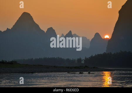 Scenic Sunset Over Karst Mountains Formations In Guilin, One Of China Most Popular Tourist Destinations Stock Photo