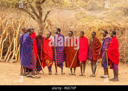 Massai Group With Traditional Clothing In Masai Mara, Kenya Stock Photo