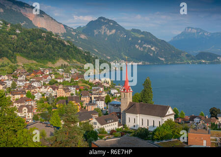 Parish Church St Maria And The Village Of Weggis Along The Shore Of Lake Lucerne, Switzerland Stock Photo