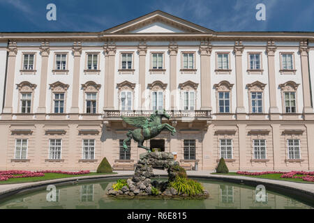 Facade Of Schloss Mirabell Palace, With A Bronze Pegasus On Pegasus Fountain In Front, Sculptor Kaspar Gras, Salzburg Austria Stock Photo