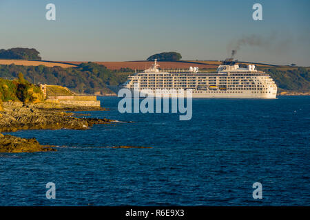 Luxury Cruise liner The World pulls into Falmouth docks in Cornwall for an overnight stop at one of Cornwalls most iconic destinations. Stock Photo