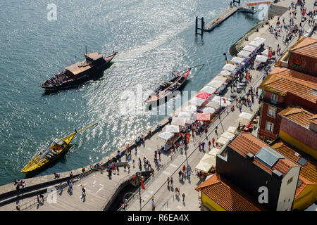 Porto, Portugal - September 16, 2018 : On the banks of the Douro River of the beautiful city of Porto the Rebelo boats, traditionally transported the  Stock Photo