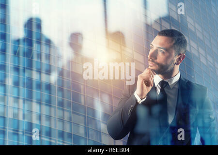 Businessman thinks new strategies to grow up the company. double exposure Stock Photo
