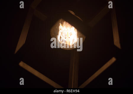 Lightbulb with square ceiling lamp Stock Photo