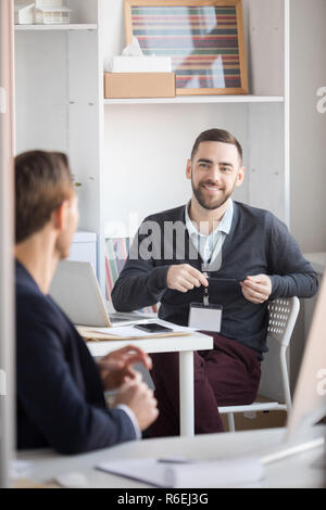 Colleagues Talking in Office Stock Photo
