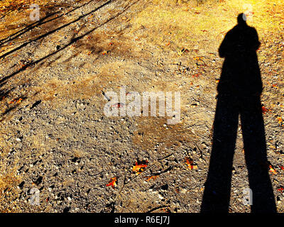 Shadow of a man on the ground texture Stock Photo - Alamy