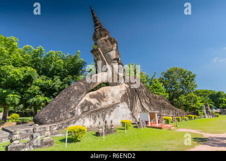 The Large Reclining Buddha At Xieng Khuan Buddha Park Near Vientiane, Laos Stock Photo
