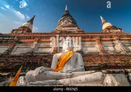 Buddha Statue In Front Of Stupa At Wat Yai Chai Mongkhon, Ayutthaya, Thailand, Unesco World Heritage Site Stock Photo
