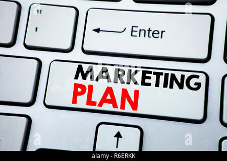 Writing text showing Marketing Plan. Business concept for Planning Successful Strategy written on white keyboard key with copy space. Top view. Stock Photo