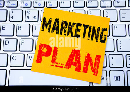 Marketing Plan. Business concept for Planning Successful Strategy written on sticky note paper on the white keyboard background. Stock Photo