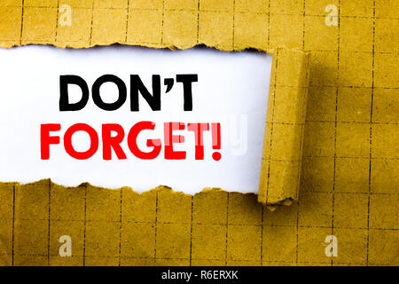 Word, writing Do Not Forget. Business concept for Reminder Message written on white paper on the yellow folded paper. Stock Photo