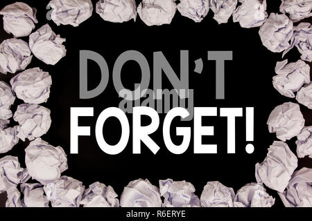 Word, writing Do Not Forget. Business concept for Reminder Message written on black background with copy space on old background with folded paper balls Stock Photo