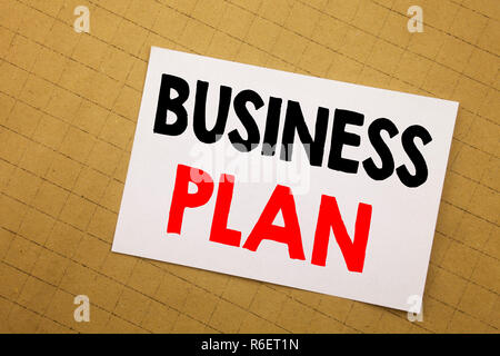 Conceptual hand writing text caption inspiration showing Business Plan Planning. Business concept for Preparation Project Strategy Written on sticky note yellow background. Stock Photo