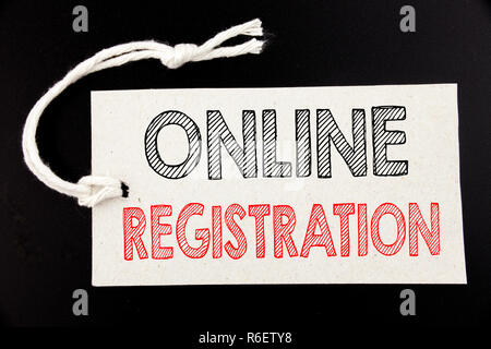 Handwritten text caption showing Online Registration. Business concept writing for Internet Login written on price tag paper on the black vintage background. Stock Photo
