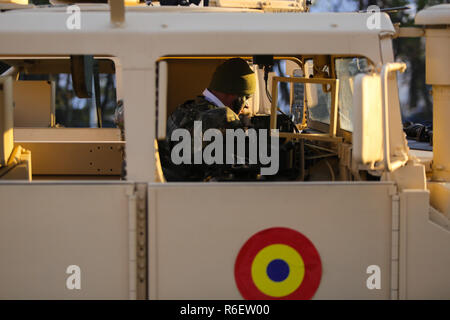 BUCHAREST, ROMANIA - December 1, 2018: Romanian soldier in a Humvee military vehicle from the Romanian army at Romanian National Day military parade Stock Photo