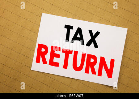 Conceptual hand writing text caption inspiration showing Tax Return. Business concept for Accounting Money Return Written on sticky note yellow background. Stock Photo