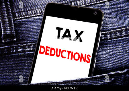 Writing text showing Tax Deductions. Business concept for Finance Incoming Tax Money Deduction written mobile cell phone with copy space in the back pants trousers pocket Stock Photo