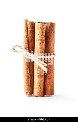 Cinnamon sticks isolated on white background. Cinnamon sticks related to the string. Stock Photo