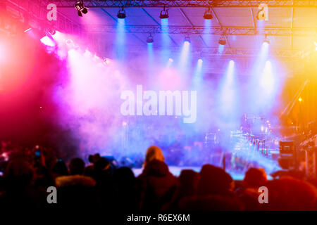 Defocused entertainment concert lighting on stage. Entertainment, concert, club, party invitation background. Stock Photo