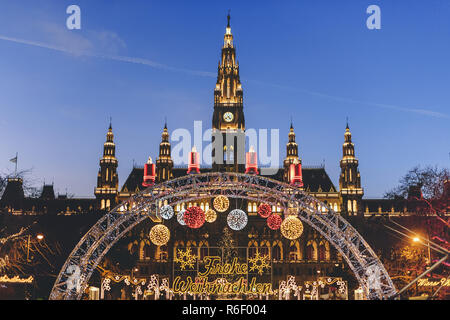 Vienna, Austria - December 24, 2017. Traditional Christmas market in front of the Rathaus City hall of Vienna. Xmas fair decorated with lights and Vie Stock Photo