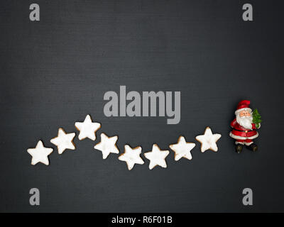 christmas background with different small christmas items on blackboard Stock Photo