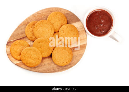 Ginger biscuits with a mug of hot chocolate, shot from the top on a white background with a place for text Stock Photo