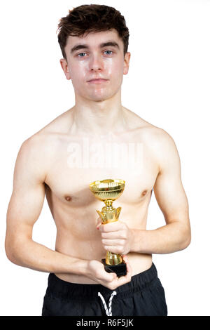 Successful caucasian young adult swimmer isolated on white background with award Stock Photo