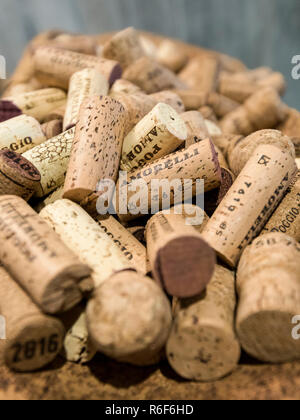 Vertical close up of lots of used wine bottle corks. Stock Photo