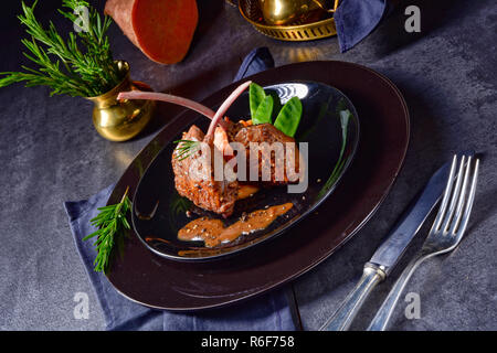 lamb steaks with rosemary sweet potatoes Stock Photo