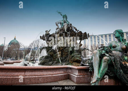 The antique Neptune Fountain built in 1891 designed by Reinhold Begas in a cold end of winter day Stock Photo