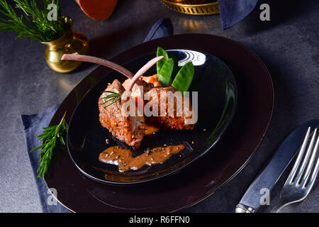 lamb steaks with rosemary sweet potatoes Stock Photo