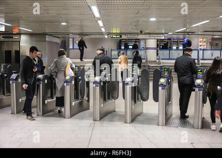 Entrance to the under ground station. King's Cross St Pancras tube station in London is an underground station for the subway in Central London serving the Piccadilly (blue) line. Stock Photo