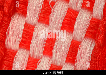 Extreme magnification - Red and white knitted fabric texture Stock Photo