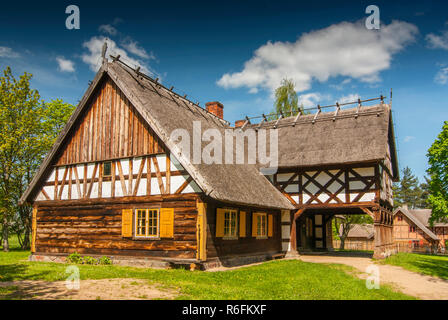 Replica Of Early 20Th Century Hut With Arcade Extension, Partly Half-Timbered Wall And Thatched Roof From Masuria Region, The Folk Architecture Museum Stock Photo